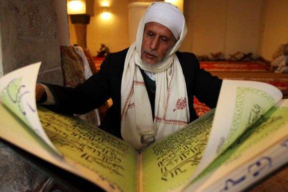 A man reads the Koran in a mosque during Ramadan in Sanaa