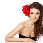 Beautiful woman with  red flowers