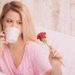 image-woman-romantic-drinking-coffee-holding-a-rose-in-bed