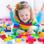 girl-playing-with-colorful-blocks