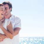 laughing-young-couple-on-beach
