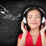 Music – woman wearing headphones listening to music with music n