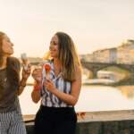 2young-friends-portrait-while-eating-ice-cream-585062158_4930x3287
