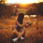 Girl-Making-Soap-Bubbles-in-Forest