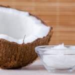 organic-coconut-oil-in-a-glass-bowl-and-coconut-on-royalty-free-image-891373694-1553109072